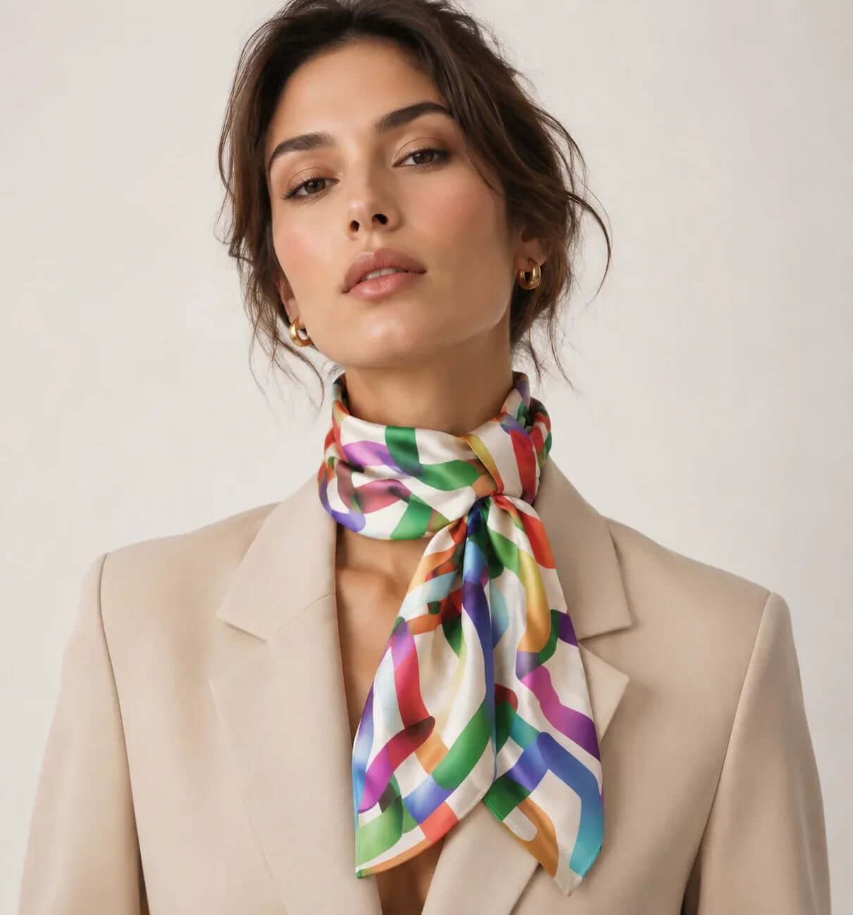 Vibrant silk scarf with ribbon pattern styled around the neck